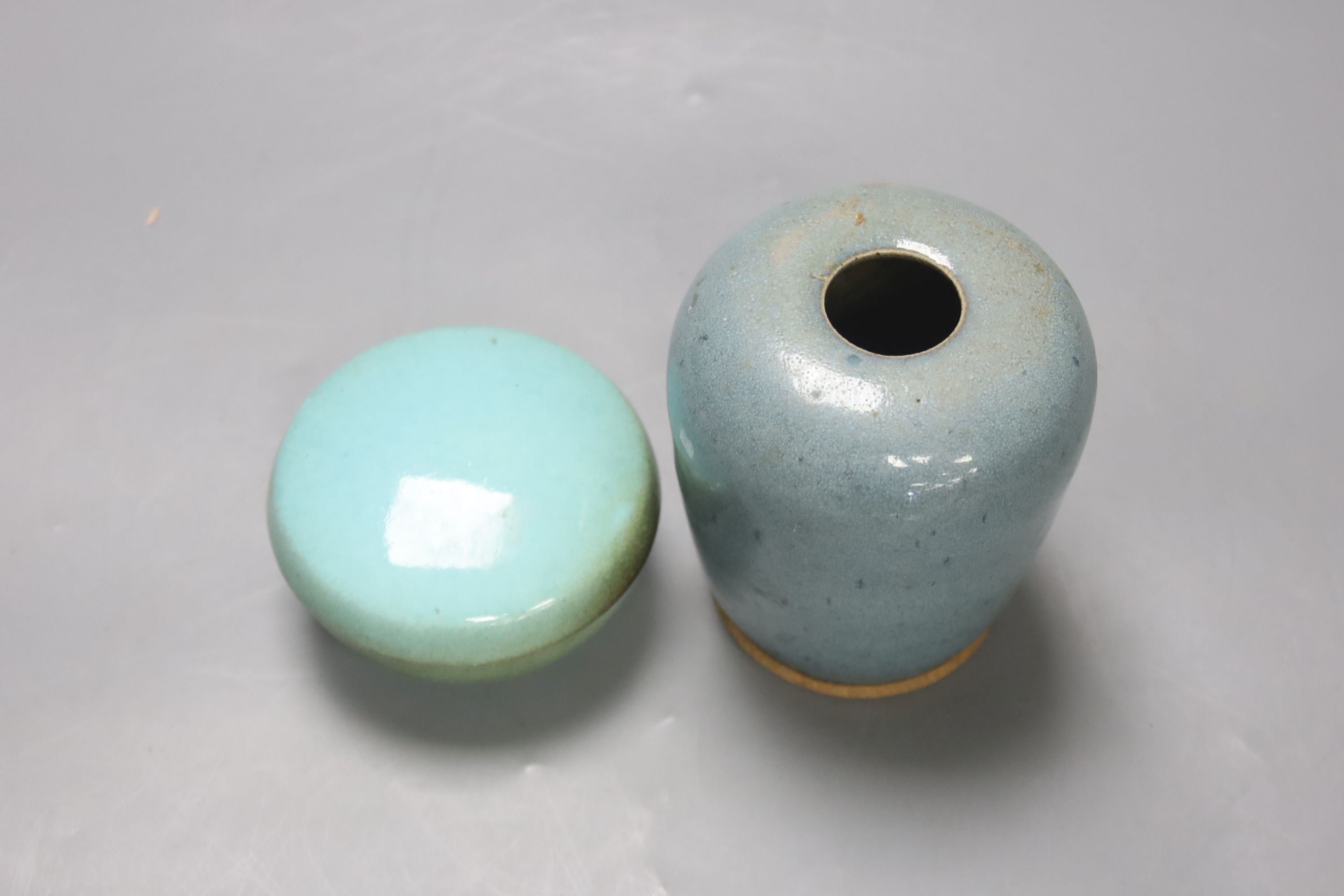 A robin’s-egg glazed Studio pottery vase, height 11.5cm, and a box